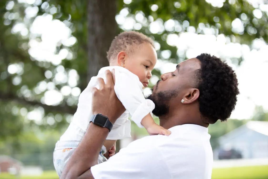 Father holding baby up