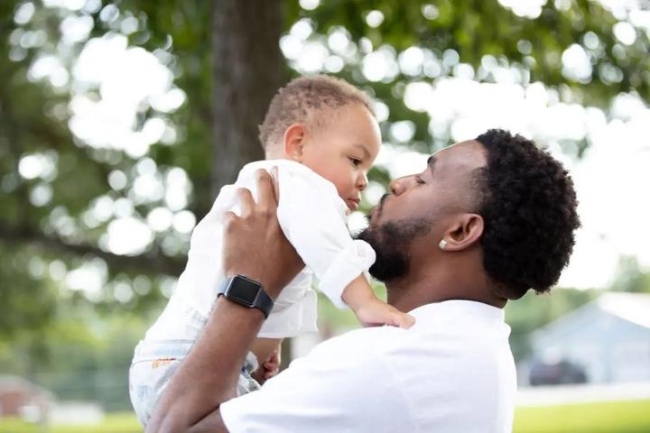 Man holding child up