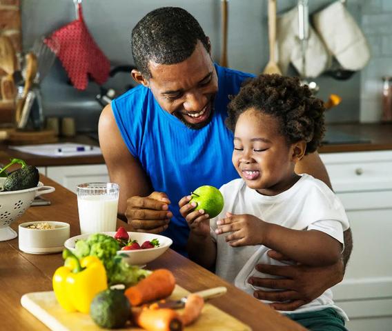 Man sitting with child at a counter