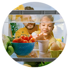 Man and child looking into a fridge