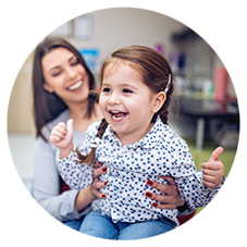 Woman with smiling child on her lap