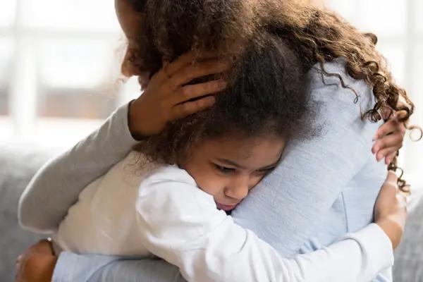 Woman and child hugging